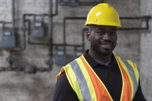 Worker wearing vest and hard hat