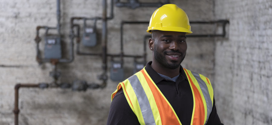 Worker wearing vest and hard hat