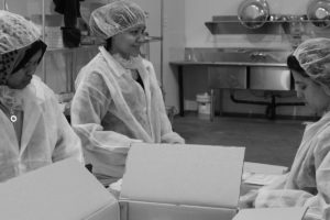 Women working in food packaging plant