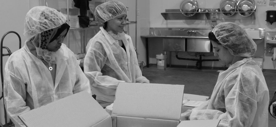 Women working in food packaging plant