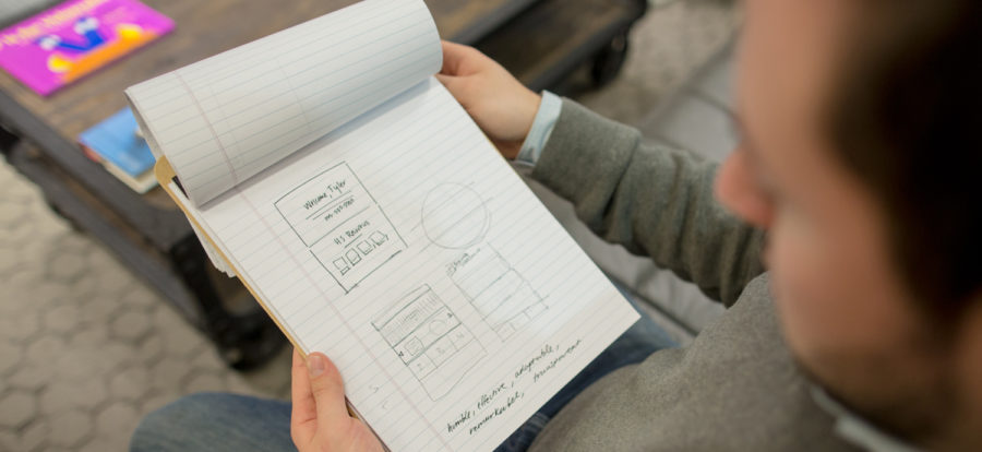 Man reading from notepad