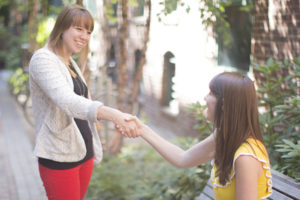 Women shaking hands