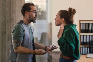 Man and woman arguing and gesturing