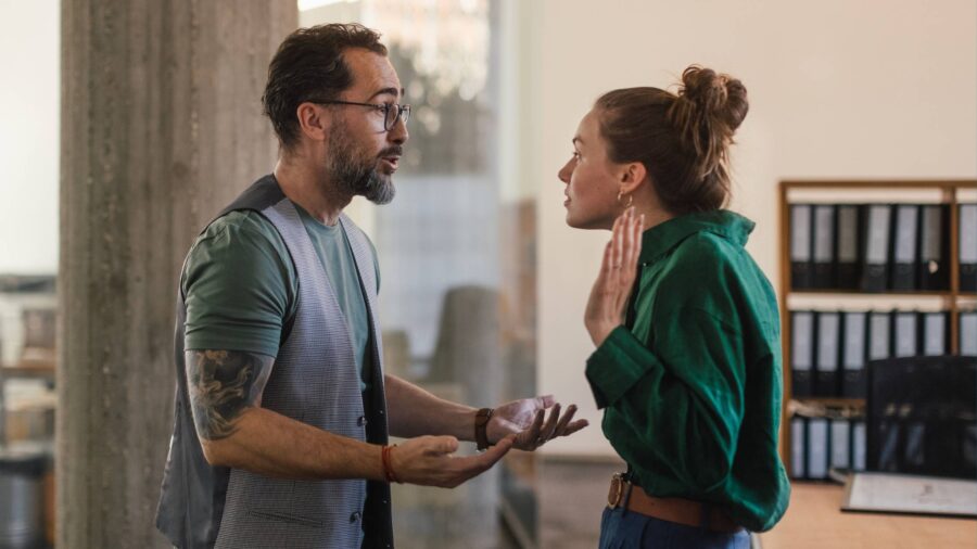 Man and woman arguing and gesturing