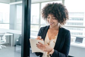 Direct hire checklist being completed by businesswoman
