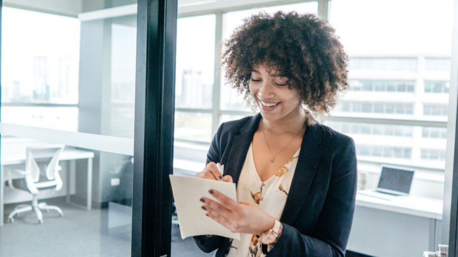 Direct hire checklist being completed by businesswoman